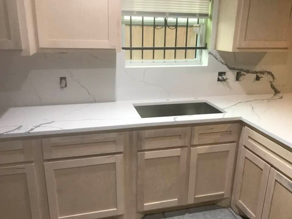 Kitchen with waterfall quartz island