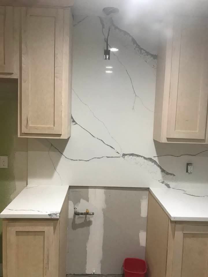 Kitchen with waterfall quartz island — 2