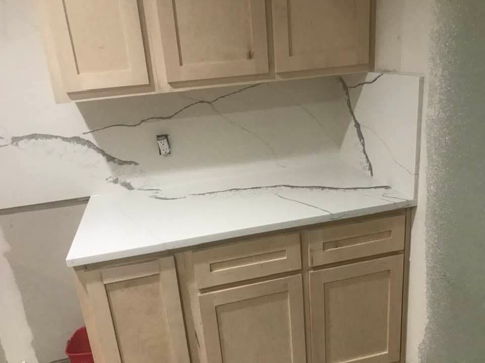 Kitchen with waterfall quartz island — 3