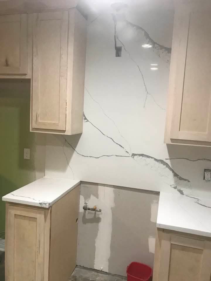Kitchen with waterfall quartz island — 4