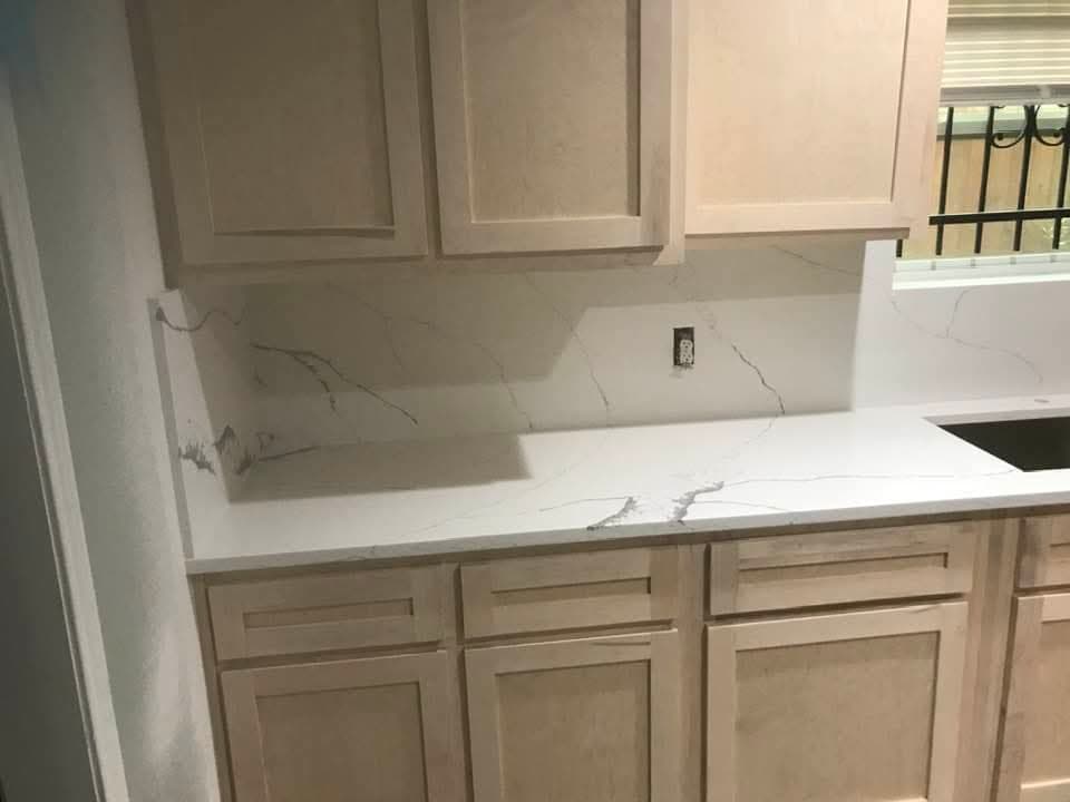 Kitchen with waterfall quartz island — 5