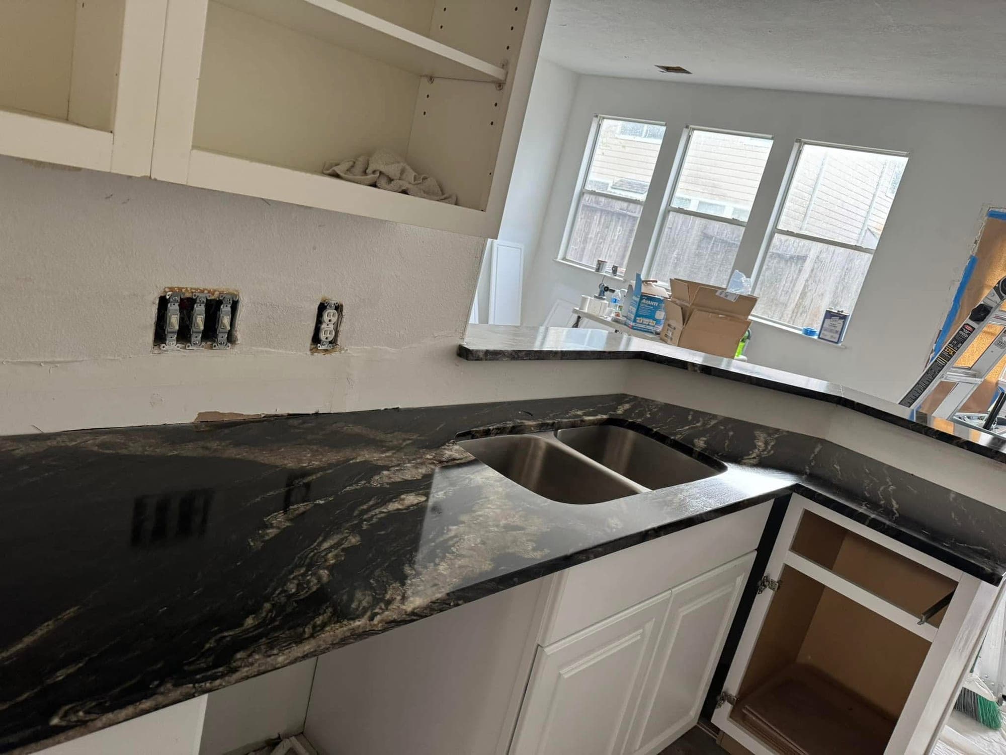 Kitchen with dark quartz countertop