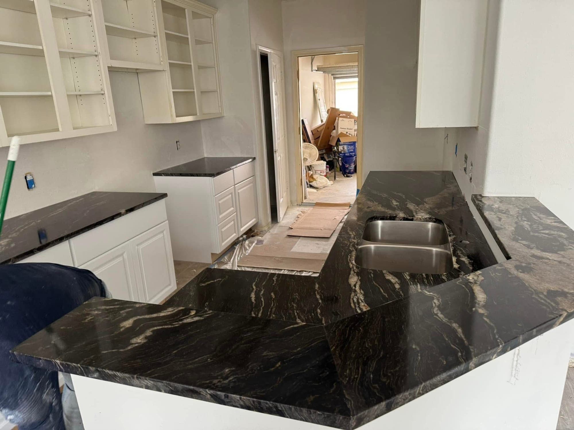 Kitchen with black granite countertop