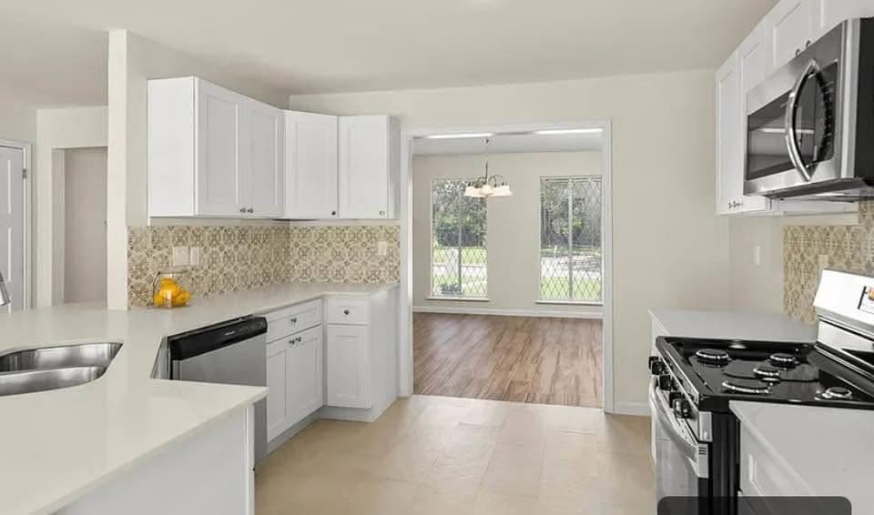 Kitchen with decorative backsplash — 2