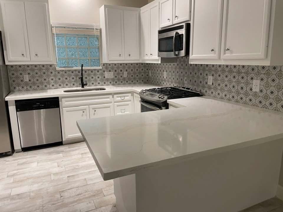 Kitchen island with patterned tile backsplash