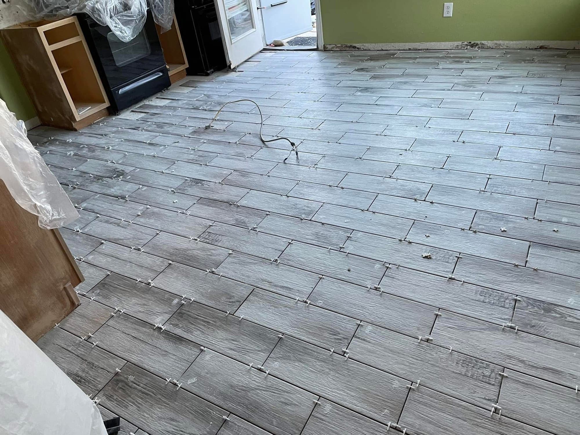 Marble-look flooring from the staircase to the kitchen — 2